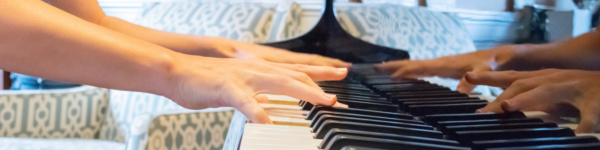 Hands playing piano